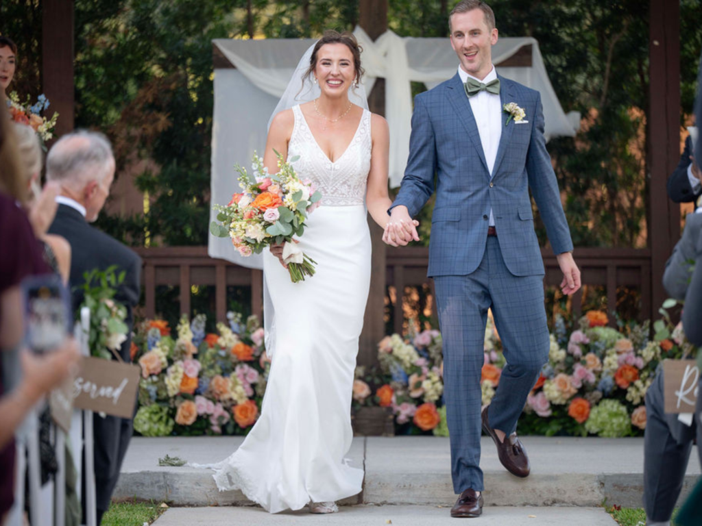 The Holmes wedding outdoor ceremony at Rosehill Oaks in Cypress Texas
